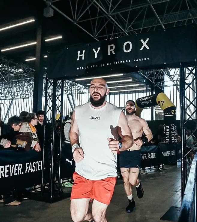 Olivier, founder of EVOX, running through the Hyrox arch at Hyrox Toulouse